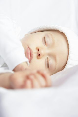 Serene image of a baby peacefully sleeping, capturing innocence and calmness.