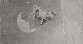 Whimsical grayscale image with a kitten, cow jumping over moon, and violin in a vintage style.