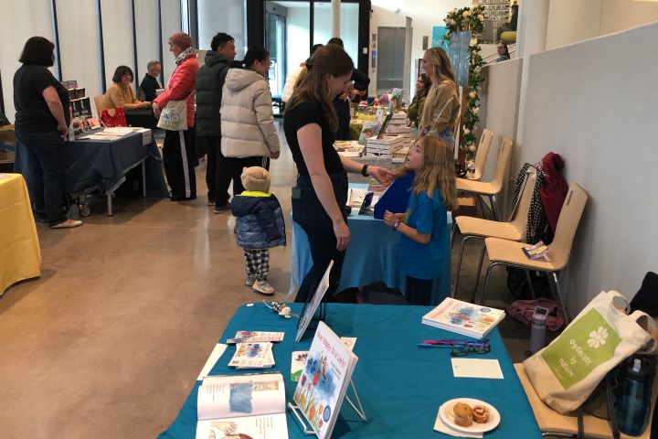 Author tables at the Baldwin Bibliophile Bonanza, authors and visitors