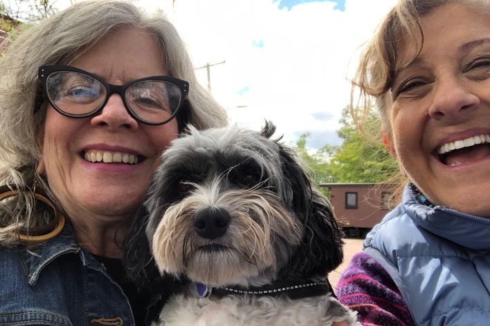 Selfie of Peggy, Gail and small dog in the middle.