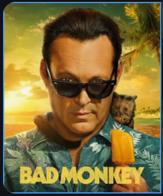 Bad Monkey TV show promo photo with Vince Vaughn holidng an orange popsicle with a little monkey on his shoulder.