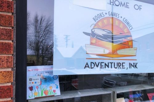 Adventure, Ink storefront, How Happy Is a Lark? in the window