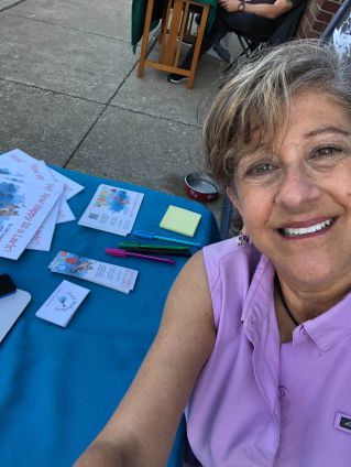 Selfie of Gail at her Adventure, Ink, table.