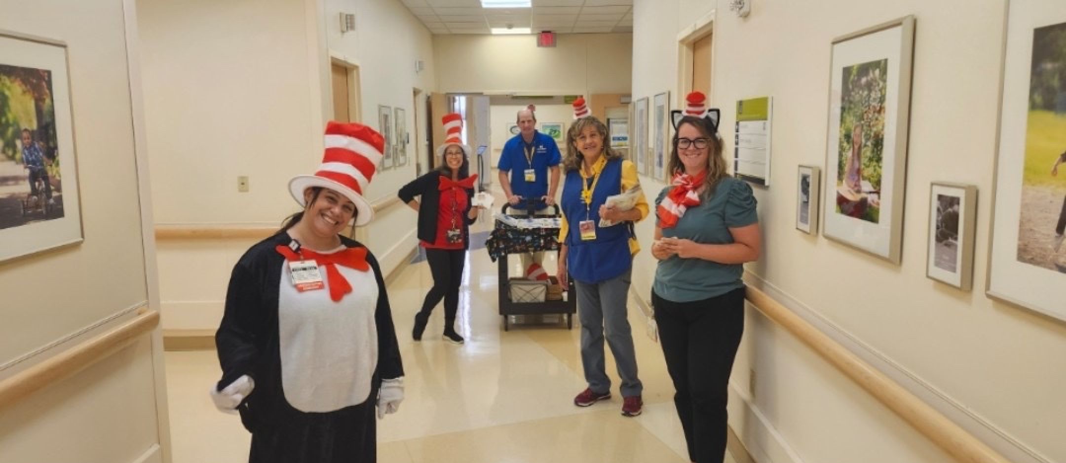 University of Michigan NICU employees and volunteers in the hallway ready to hand out books for the Read-a-thon.