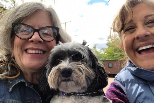Selfie of Peggy, Gail and small dog in the middle.